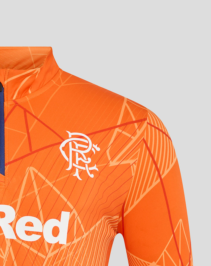 Left chest close-up featuring the white Castore logo and bold 32Red lettering on the orange geometric midlayer