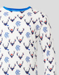 White men's festive long sleeve pajama top and bottoms with blue cuffs and collar in allover reindeer print.