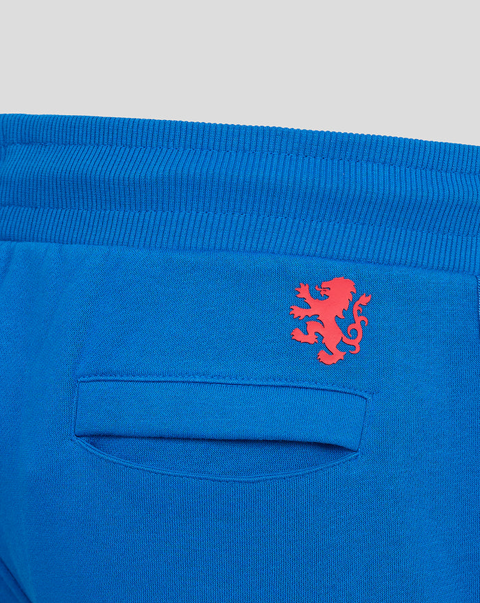 Close up of blue elastic waistband and red crest logo near the back pocket on Junior Classic Rangers Shorts.