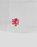 Close-up of white T shirt hem with red lion crest logo