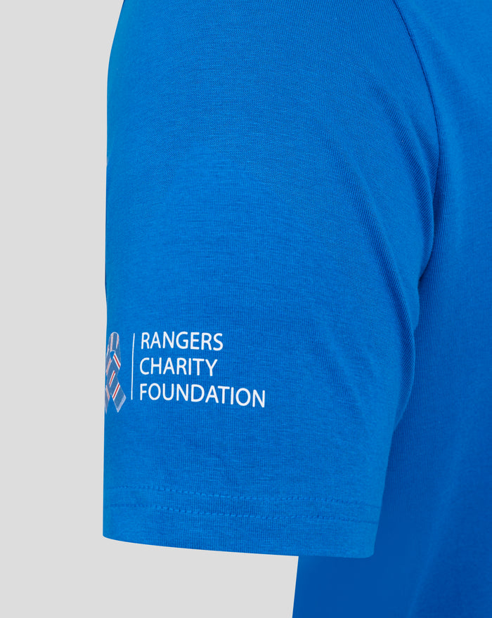 Close up of blue tee showing shoulder seam and partial Rangers Charity Foundation text near the hem.