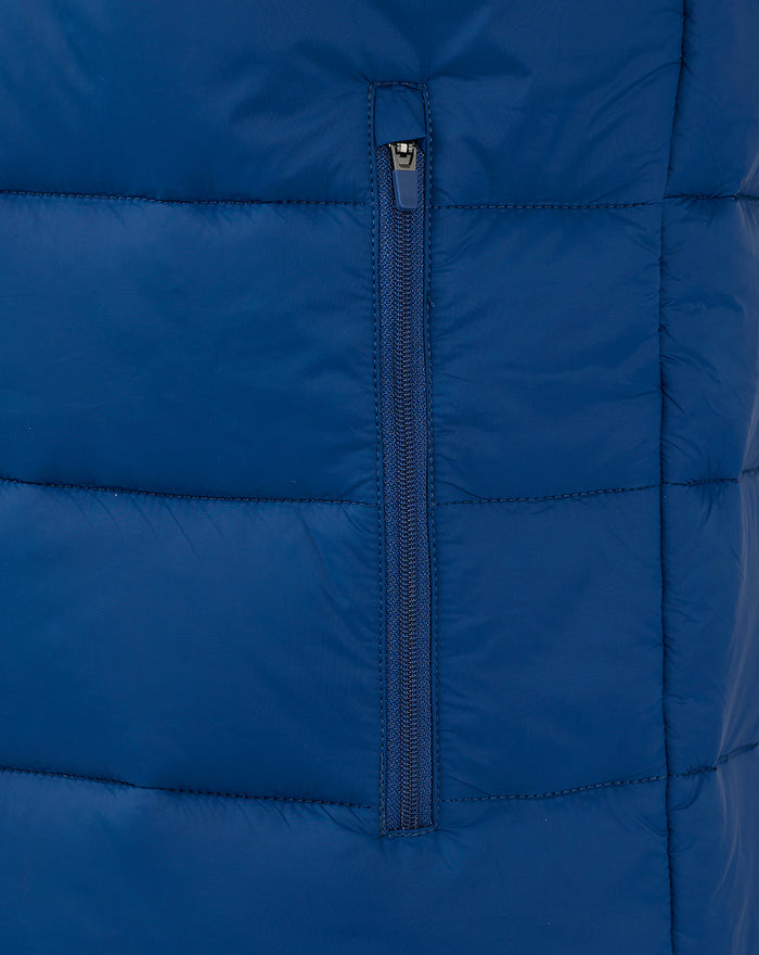Close-up of navy padded gilet centre front zip with blue puller and quilted panels