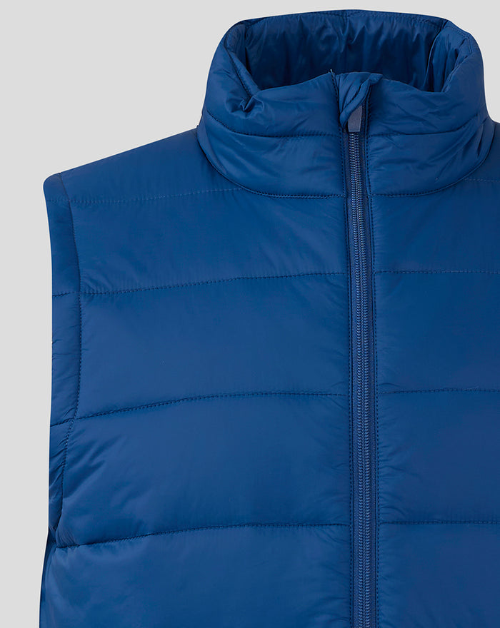 Close-up of navy blue padded gilet with high funnel collar and front zip