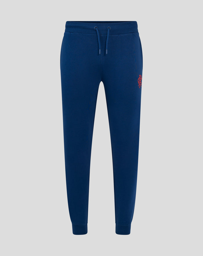 Front view of navy Junior Core Joggers with drawstring waistband and red crest on the thigh
