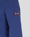 Close-up of blue sleeve patch with red border and white logos from Castore.