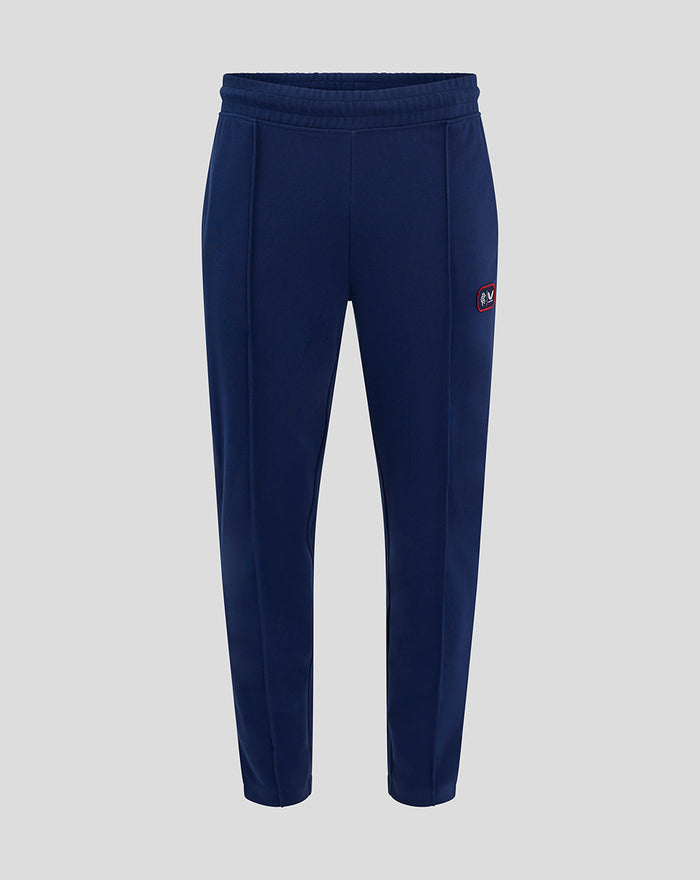 Front view of blue RFC tracksuit pants with elastic waistband white side piping and crest patch on left leg