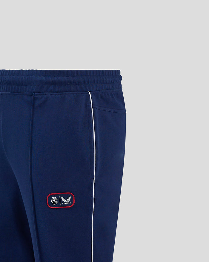 Close up of blue RFC tracksuit pants showing crest patch on left thigh and white side piping