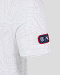 Close up of T shirt fabric showing geometric print and Castore emblem near the hem