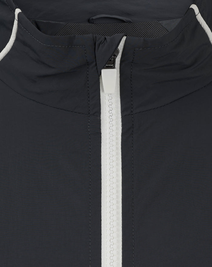 Close up of navy Rangers windbreaker zipper with stand collar and mesh neckline