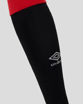 Close up of Rangers FC Junior Home Sock shows black fabric with white crest branding on the lower leg
