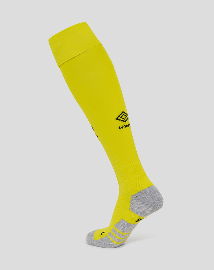 Bright yellow junior home goalkeeper sock shown on a leg with grey heel and toe and Umbro logo on the shin