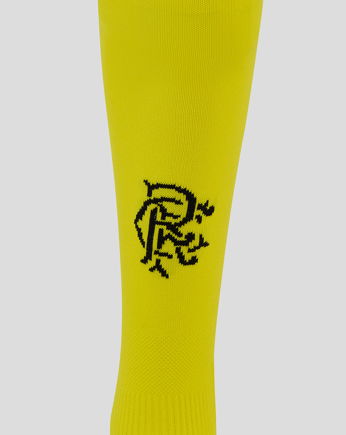 Yellow junior home goalkeeper sock with a black scroll crest on the shin and grey toe accents