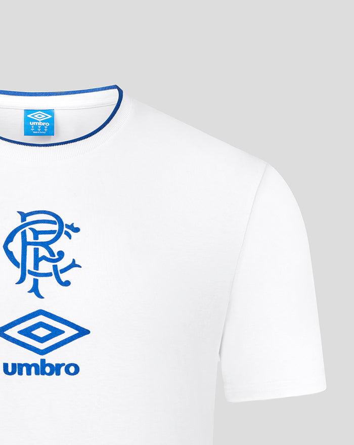 Close up of white crew neck T shirt showing blue rib trim at the collar and Umbro tag.