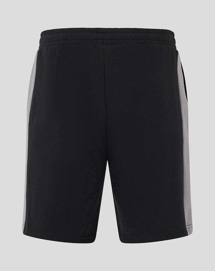 Back view of Unisex Travel Shorts in Caviar black with grey side panels and an elastic waistband