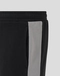 Close-up of waistband and grey side panel on Unisex Travel Shorts in Caviar