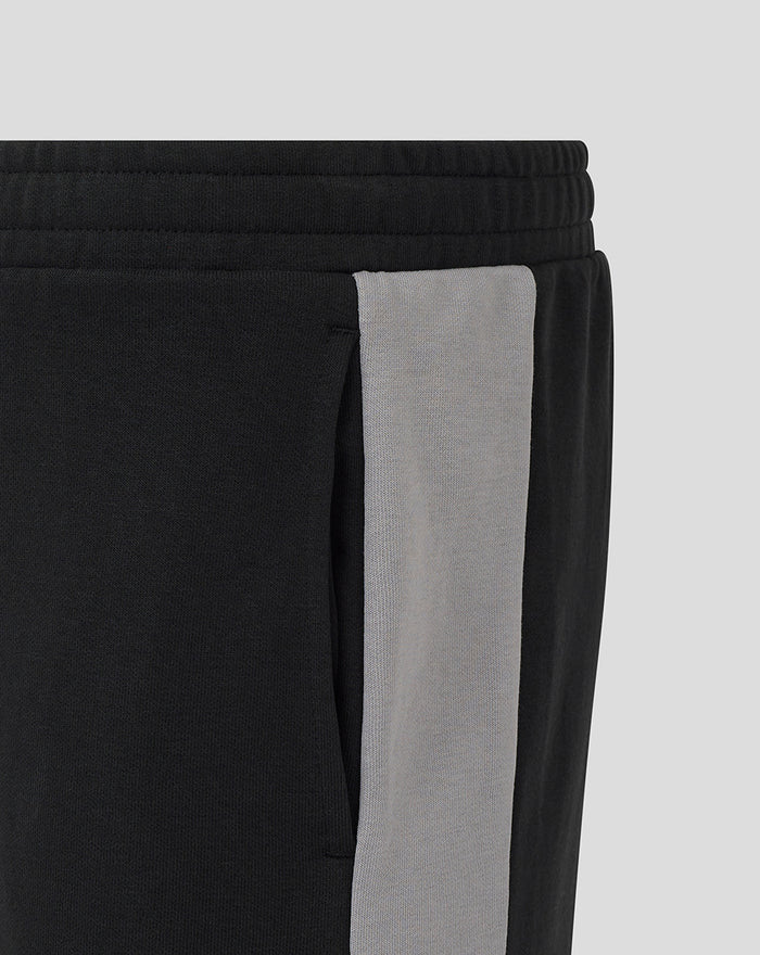 Close-up of waistband and grey side panel on Unisex Travel Shorts in Caviar