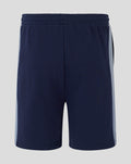Back view of navy unisex travel shorts with elastic waistband and light side panels.
