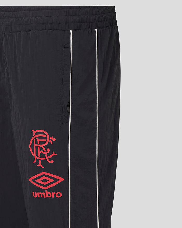 Close-up of waistband with drawcords and a concealed side zip pocket on black travel pants