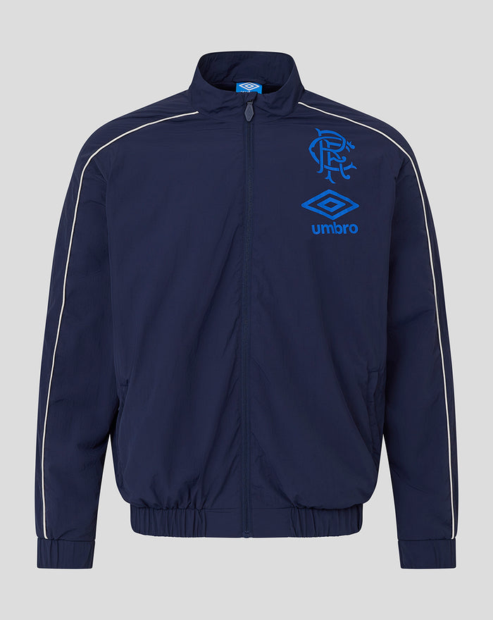Unisex navy travel track jacket with zip front and white piping along the sleeves featuring a crest and Umbro logo.