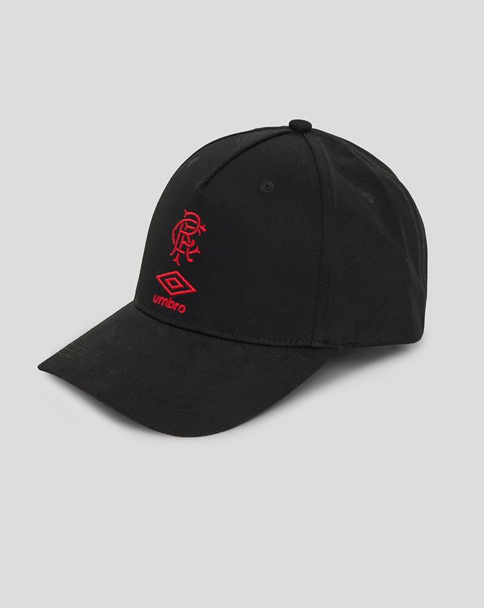 Angled side view of black junior travel cap with red embroidered crest and Umbro logo.