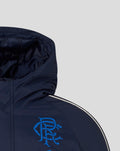 Left chest area with blue crest graphic and Umbro logo on navy jacket