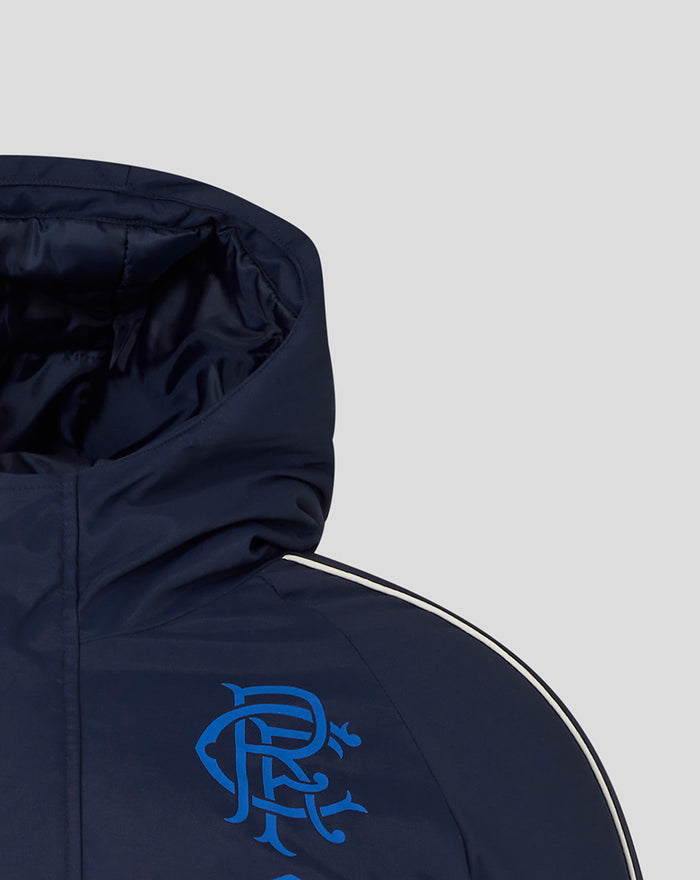 Left chest area with blue crest graphic and Umbro logo on navy jacket