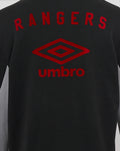 Back view of black junior travel hoodie with Rangers lettering and red Umbro emblem on the upper back.