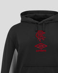 Close-up of black travel hoodie with hood and red Umbro club crest on the chest