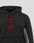 Close-up of black travel hoodie chest with drawstrings on the hood and a red Umbro crest