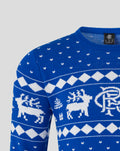 Close up of blue knit Christmas jumper with white reindeer and diamond pattern across chest
