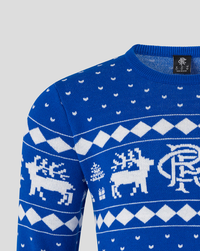 Close up of blue knit Christmas jumper with white reindeer and diamond pattern across chest