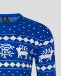 Close up of blue knit Christmas jumper neckline with white pattern and inside label reading Made in China