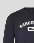Close-up of navy Rangers FC sweatshirt showing arched logo and 1872 badge