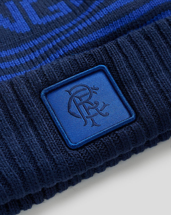 Navy Rangers knitted bobble hat with a blue patch on the cuff.