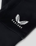 Close-up of black glove fabric with a white wing emblem