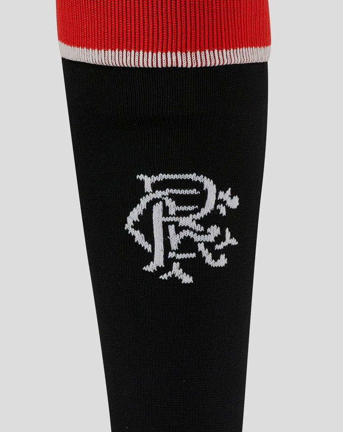Close up of red cuffed junior Rangers third alternate sock with white piping on a black leg section.