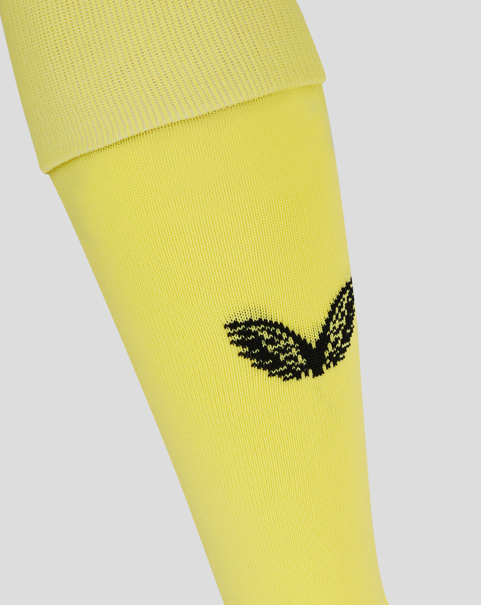 Bright yellow unisex third goalkeeper sock close up showing ribbed cuff and partial black graphic