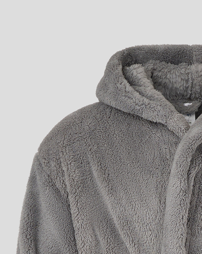 Close-up of gray plush dressing gown fabric and hood detail.