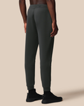 Back view of dark green Flex Jogger with tapered legs and cuffed ankles