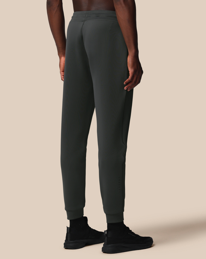 Back view of dark green Flex Jogger with tapered legs and cuffed ankles