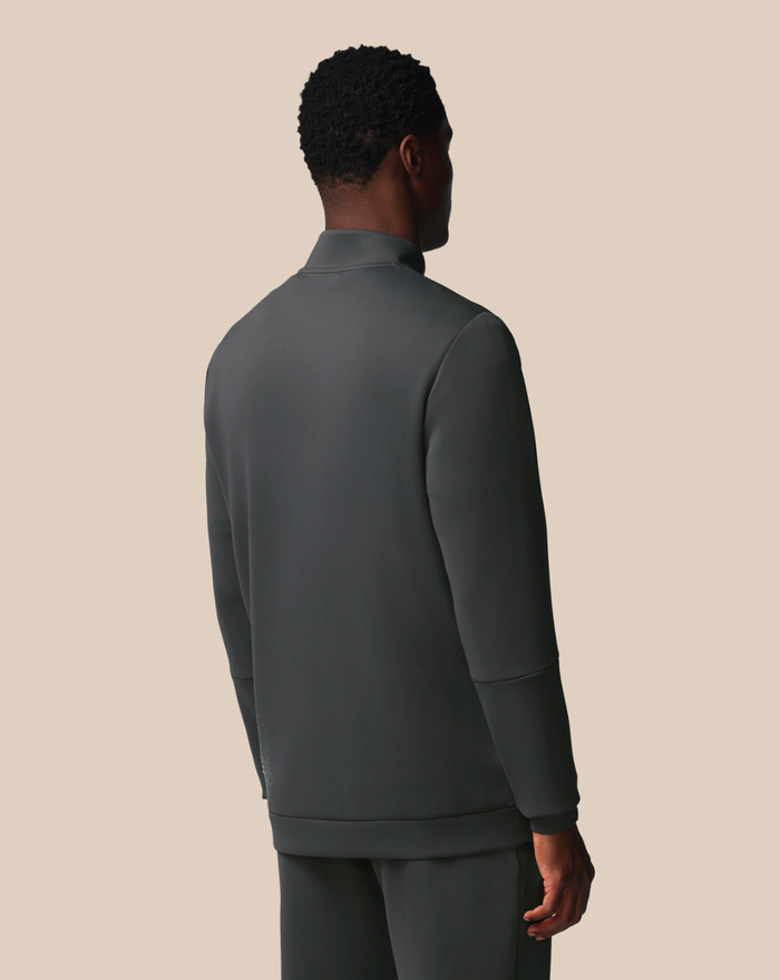 Back view of the dark gray FLEX 1/4 ZIP SWEATSHIRT on a model.