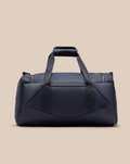 Navy CORE Holdall with dual top handles and a detachable shoulder strap against a beige background.