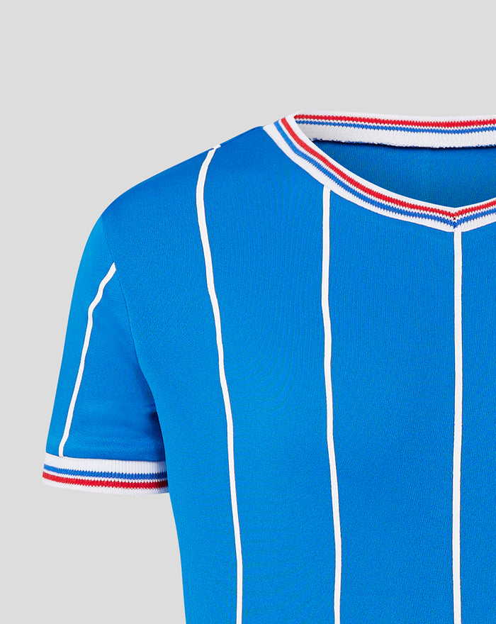 Shoulder and sleeve detail with white piping and red white striped trim on the blue retro shirt