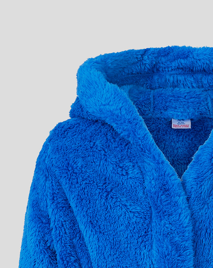 Interior neck area of blue fleece infant robe with care label visible inside.