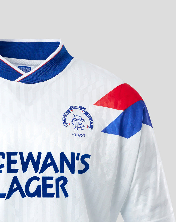 Front close-up of white Rangers away shirt with bold blue McEwan's Lager sponsor text and geometric pattern