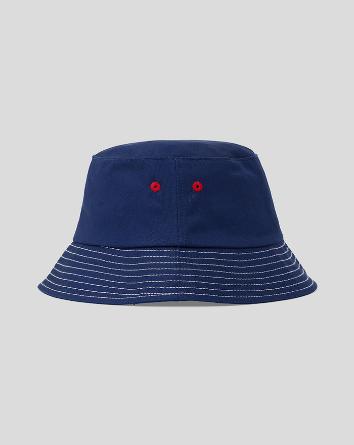 Navy cotton twill bucket hat with white contrast stitching on the brim and red eyelets.